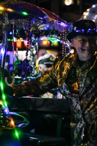 Photograph: Night Parade Reveler Smiling Bright
