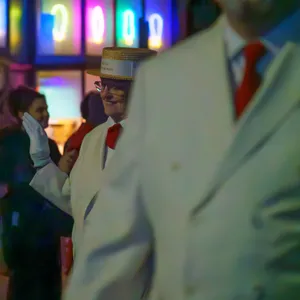 Photograph: Boater Hats Under Neon Glow