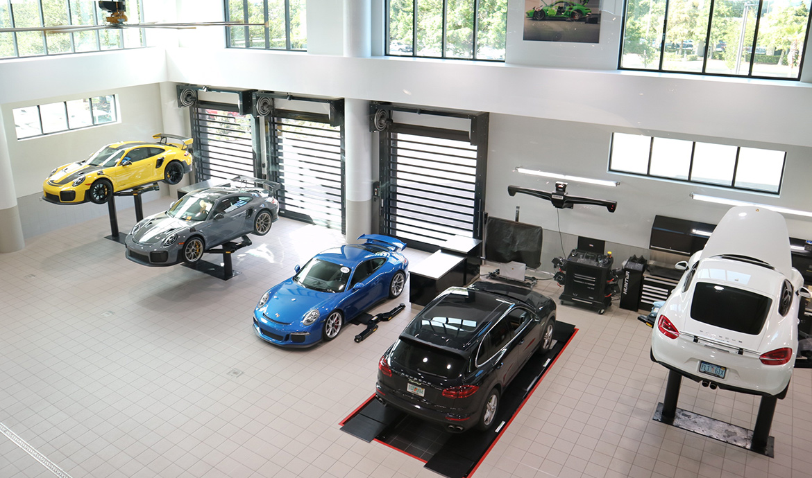 Upper shot of Porsche vehicles being serviced in Porsche South Orlando Service center