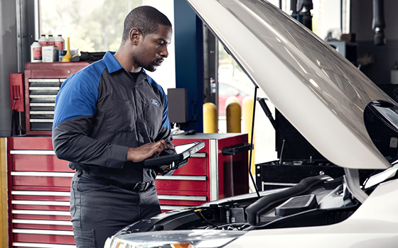 Ford Checking an Engine