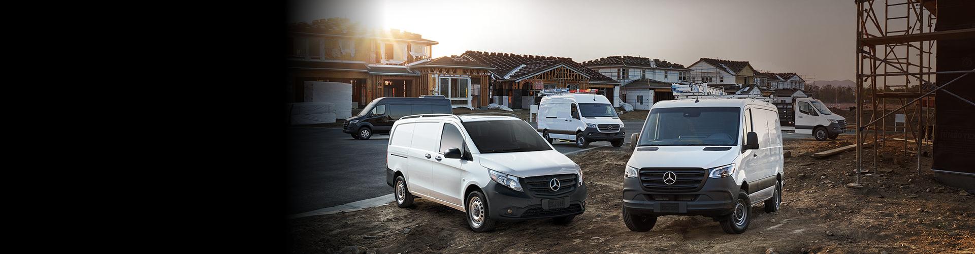 White Cargo Vans Parked at Construction Site