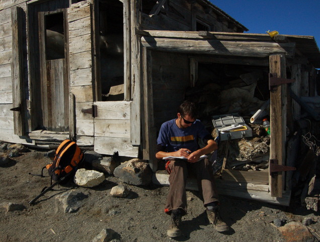 Willy signs the summit register on Mount Adams