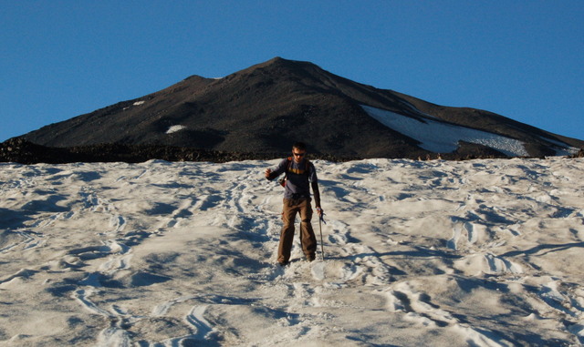 Willy glissades down Crescent Glacier below Pikers Peak