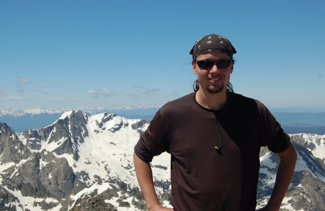 Jaeger on Mount Toll, with Mount George and the Gore Range