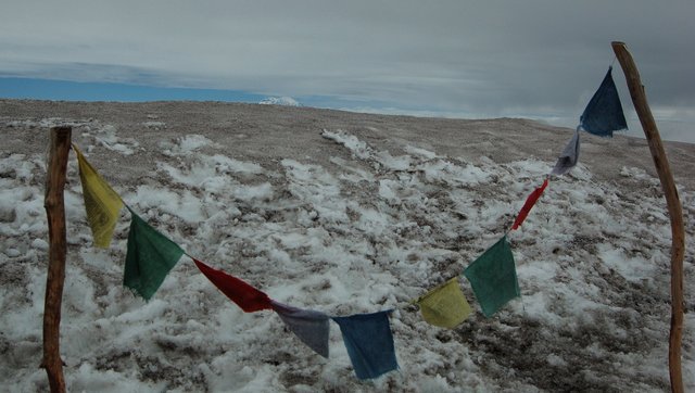 Summit prayer flags and Mount Rainier
