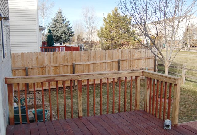 Stripped deck railing prior to being stained