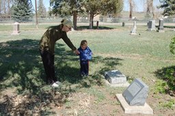 Calvin and Kiesa at the Weng gravesite in Hygiene Cemetary