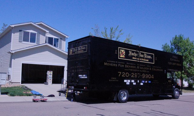 Moving truck waiting outside Monarch