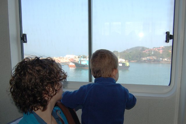 Kiesa and Calvin look out the ferry window in Cheung Chau harbor