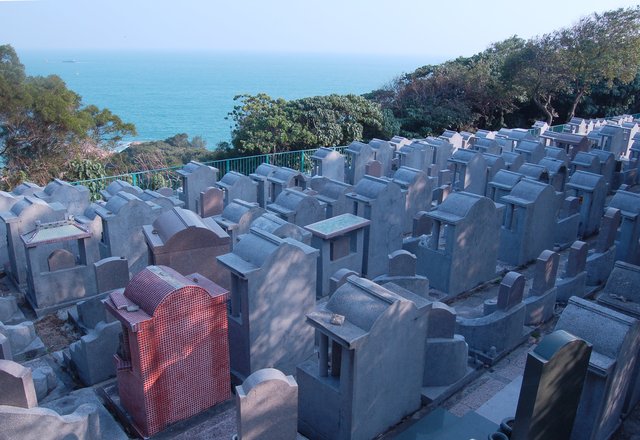 Grave markers in Cheung Chau Cemetery facing the sea