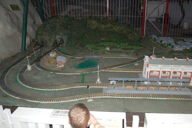 Calvin controls a model train set at the Hong Kong Railway Museum