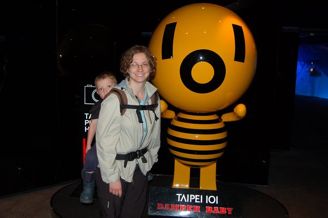 Kiesa and Calvin with a Damper Baby at the top of Taipei 101