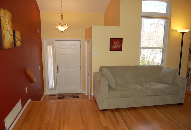 Entryway and sofa with new hard wood floors