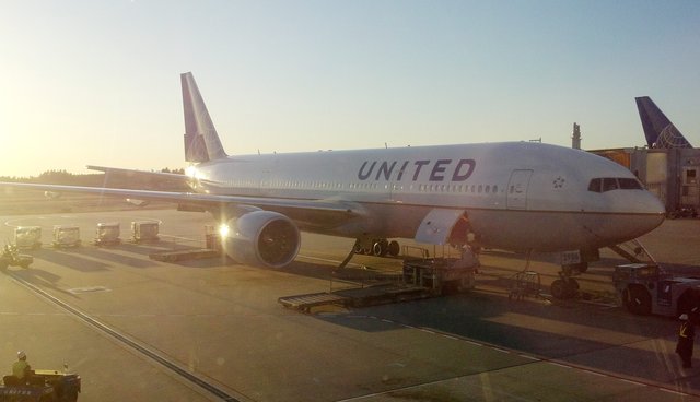 United 777-200 waiting at the gate at Narita International Airport