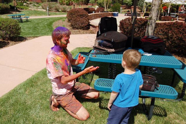 Willy prepares to photograph The Wandering Knight after Holi while Calvin looks on