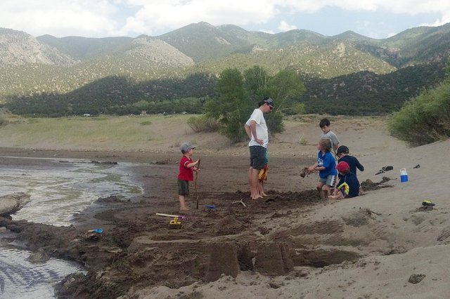 Jaeger supervises an engineering workshop at the Great Sand Dunes; Calvin watches