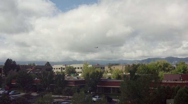 Colorado National Guard CH-47 Chinook returns to Boulder Muni Airport with flood evacuees