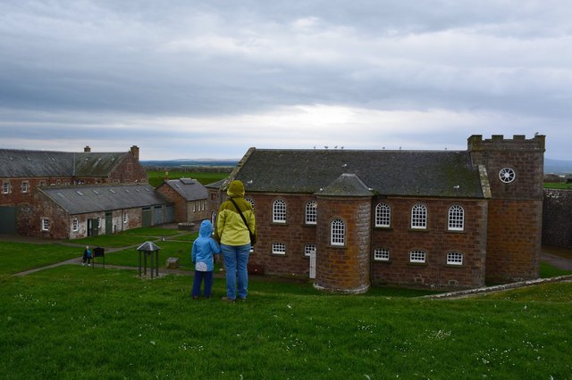 Calvin and Kiesa look at the chapel in Fort George