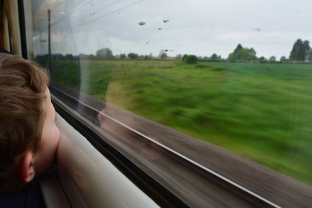 Calvin watches the English countryside roll by