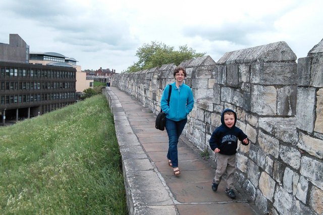 Kiesa and Calvin walk on the York city walls