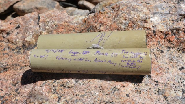 Wet summit register on Mount Logan