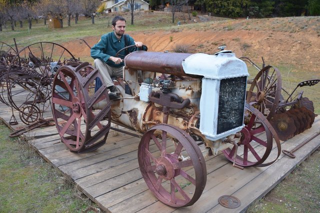 Willy rides an old Fordson tractor