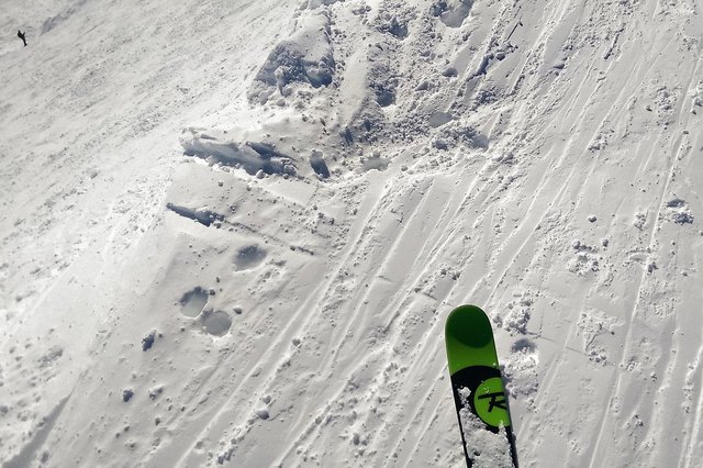 Ski about to drop into Bradley's Plunge at Copper Mountain