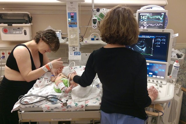 Kiesa consoles Julian while he gets an ultrasound exam in the NICU