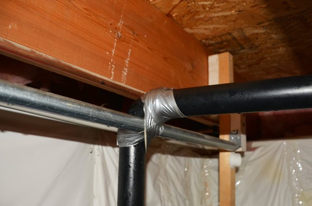 Duct tape patch on sump discharge pipe