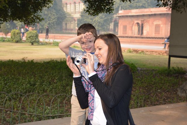 Calvin reviews pictures on Aunt Bethany's camera inside the Red Fort
