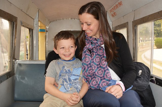 Calvin and Aunt Bethany ride the toy train at the National Railway Museum in Delhi