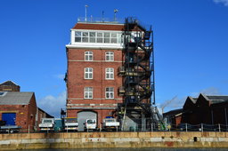 Old brick building with a modern fire escape at the Portsmouth Historic Dockyards