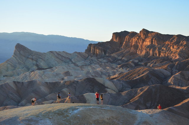 Tourists watch sunset at Zabriskie Point