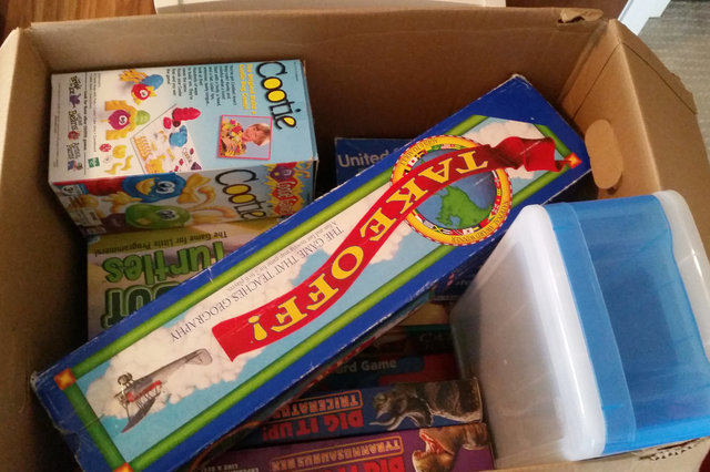 Packing a box of kid's games