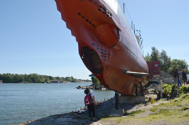 Calvin looks under the Vesikko Submarine