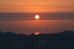 Red sun rises over San Francisco Bay