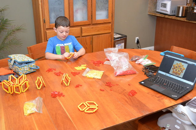 Calvin assembles a Lego polyhedra