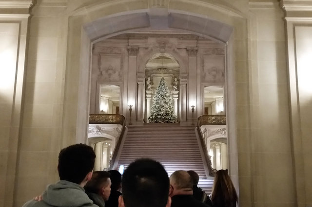 Mourners enter City Hall