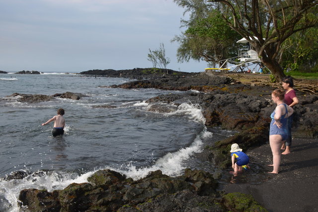 Calvin in the water and Julian, Kiesa, and Sasa on shore at Richardson's Beach Park