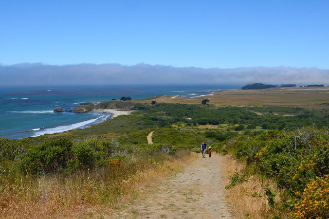 Kiesa and Julian climb above Andrew Molera State Park