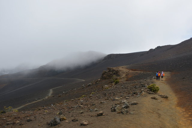 Hikers descend the Sliding Sands Trail