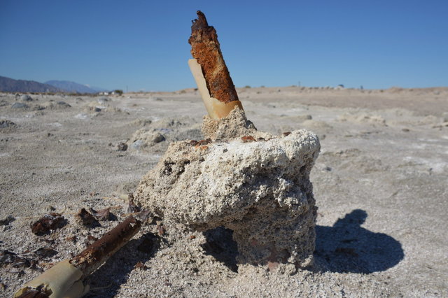 Derelict fence post rusting on the shores of the Salton Sea