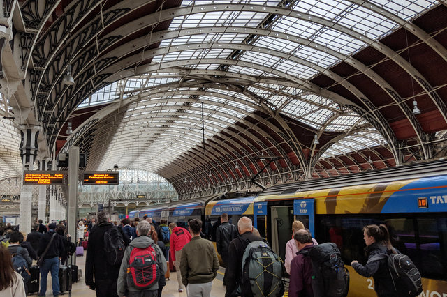 Passengers disembark from Heathrow Express at Paddington Station