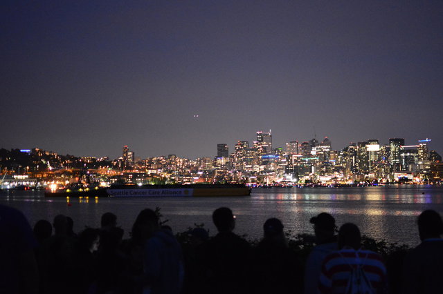 Fireworks barge in Lake Union after dark