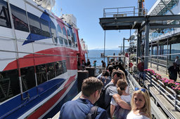 Passengers board the Victoria Clipper V in Seattle