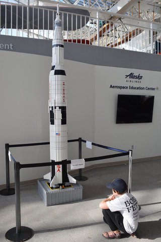 Calvin with a Lego Saturn V model