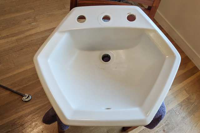 Bathroom sink with all faucets removed