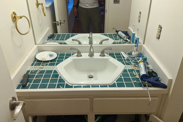 Bathroom sink dropped into place with new faucet