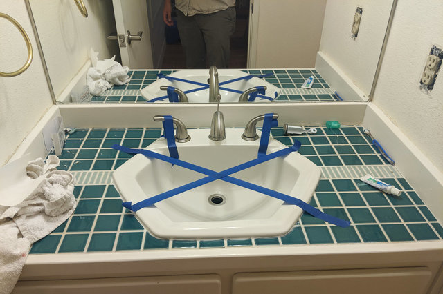 Bathroom countertop with sink caulked