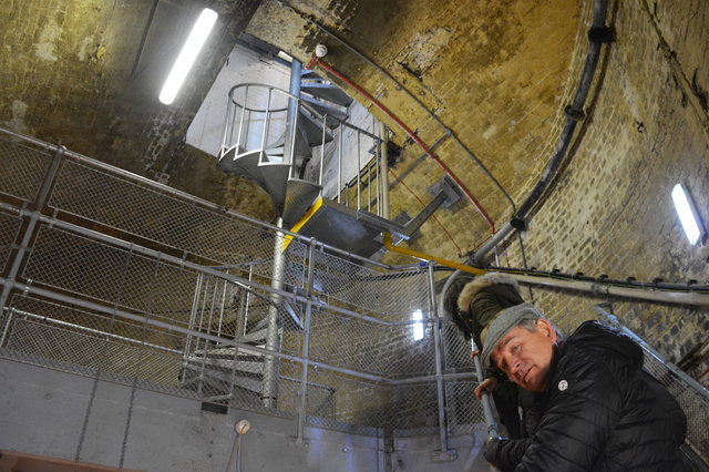 Ascending towards the spiral staircase outside the Tower Bridge pier